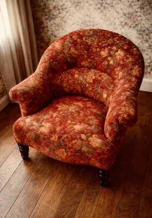 Fauteuil crapaud Napoléon III – ancien tapissé en méthode traditionnelle – Tissu fleuri rouge